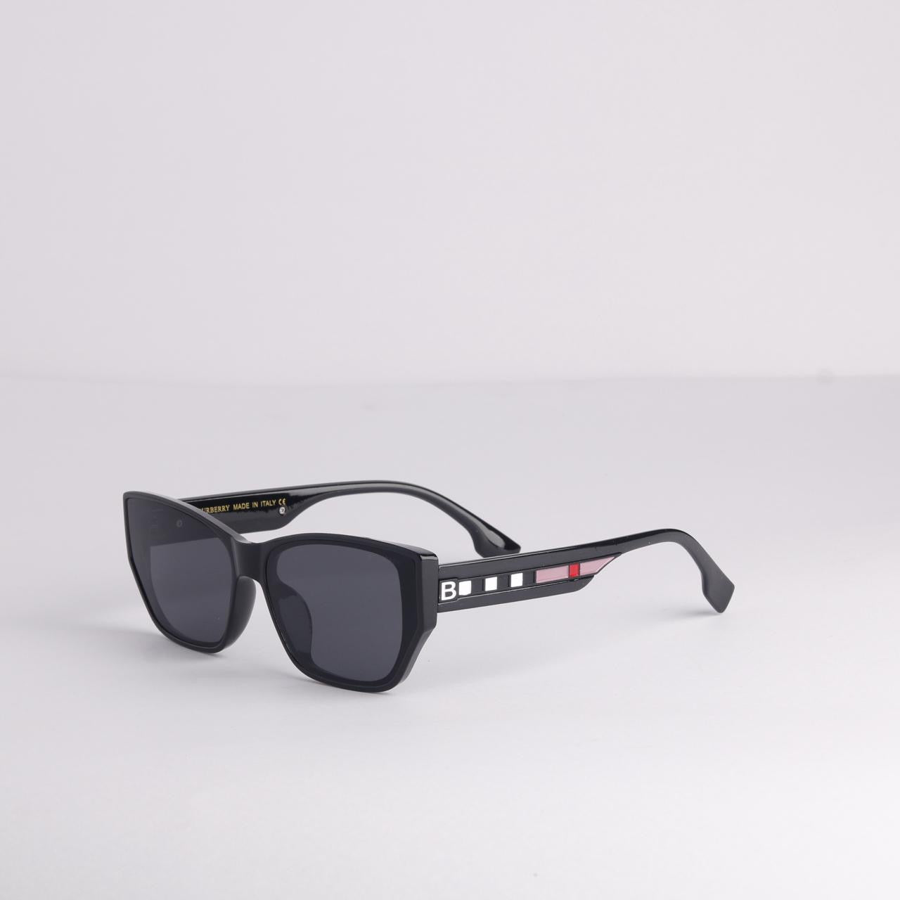 Black sunglasses with a brand logo on a light gray background