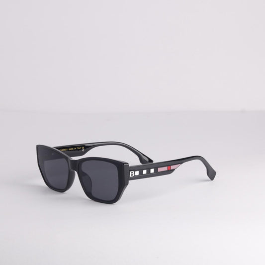 Black sunglasses with a brand logo on a light gray background